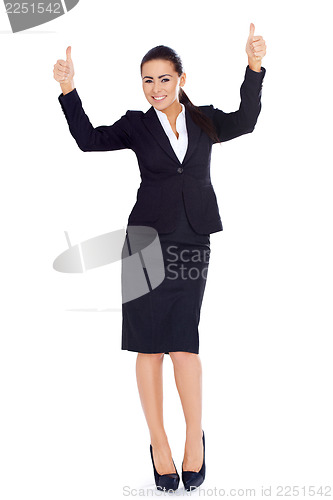 Image of Business woman standing and showing thumbs up gesture