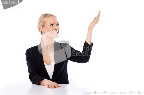 Image of Blond business woman sitting at the desk