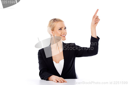 Image of Blond business woman sitting at the desk