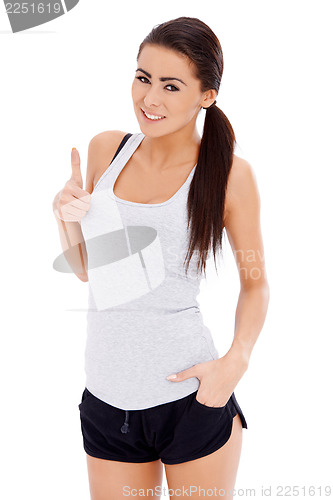 Image of Sporty woman showing thumb up gesture
