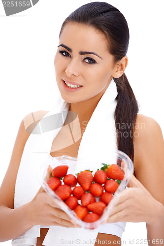 Image of Woman holding heart shaped box of strawberries