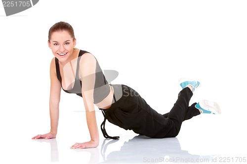 Image of beautiful fitness woman doing exercise