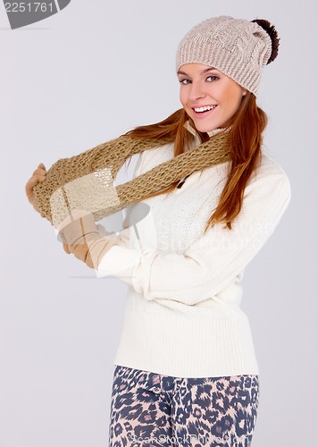 Image of Beautiful woman wearing warm winter clothes