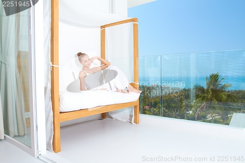 Image of Woman enjoying tropical luxury