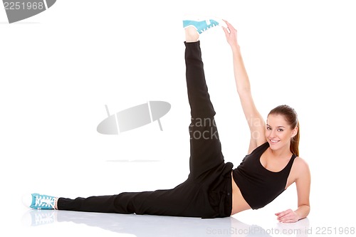 Image of Beautiful fitness woman doing stretching exercise