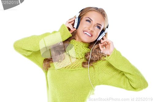 Image of Woman with headphones listen to music