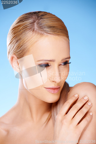 Image of Gorgeous woman portrait on blue