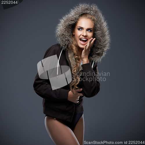 Image of Beautiful woman in a fur trimmed hood