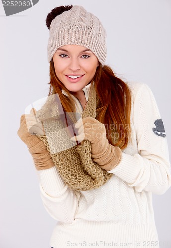 Image of Beautiful woman wearing warm winter clothes