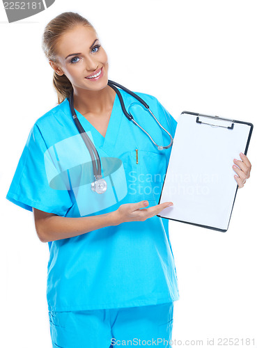 Image of Beautiful gorgeous nurse holding writingpad and smiling