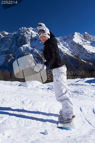 Image of Female Snowboarder in Dolomites