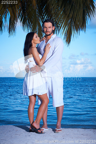 Image of Couple nex to Palm tree