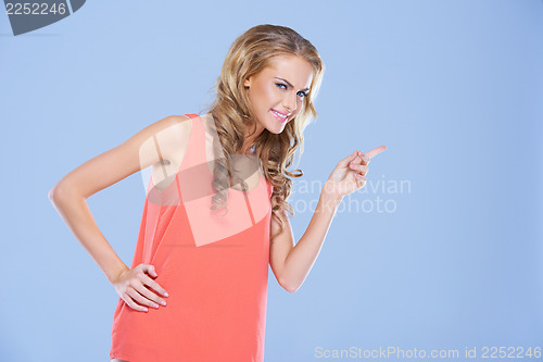 Image of Frowning woman pointing her finger