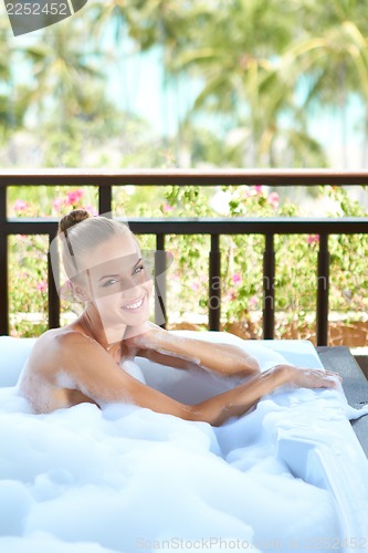 Image of Woman in open-air bubble bath