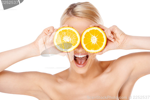 Image of Blond woman making glasses with orange halfs