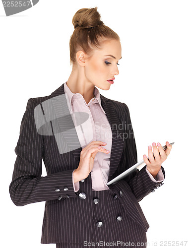 Image of Young business woman working on tablet