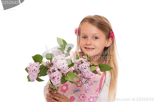 Image of Happy little girl with lilac flowers