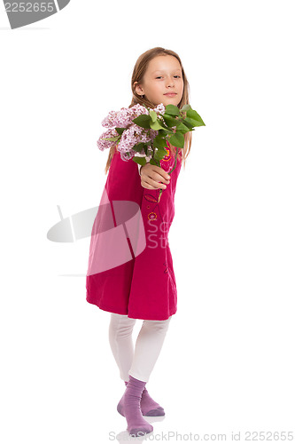 Image of Beautiful young girl with lilac flowers