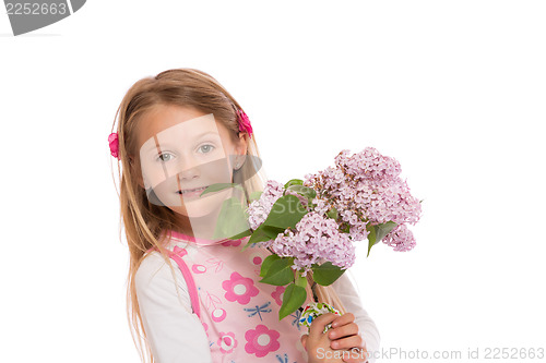 Image of Happy little girl with lilac flowers