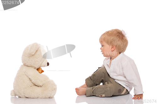 Image of Little boy and teddy bear