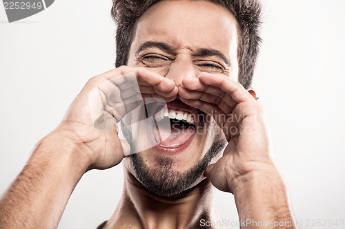 Image of Young man shouting