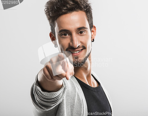 Image of Young man pointing