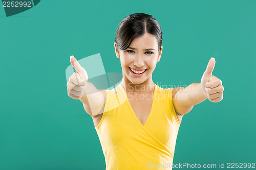 Image of Happy woman with thumbs up