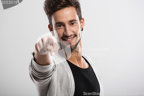 Image of Young man pointing