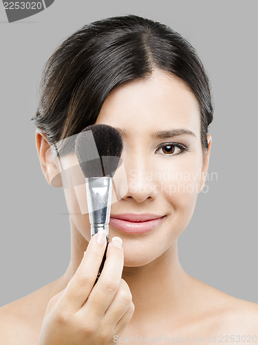 Image of Beautiful Asian woman with make-up brushes