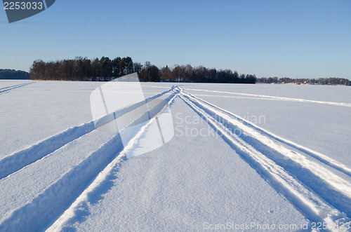 Image of Snowmobile winter transport marks frozen lake snow 