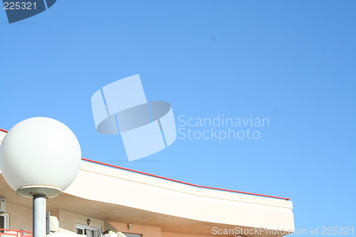 Image of Roof and lamp against the blue sky