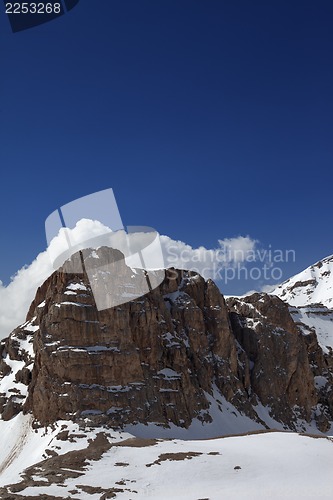 Image of Rocks in snow and blue sky