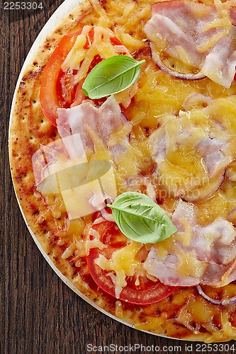 Image of Pizza with bacon and tomato