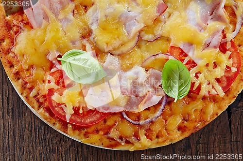Image of Pizza with bacon and tomato