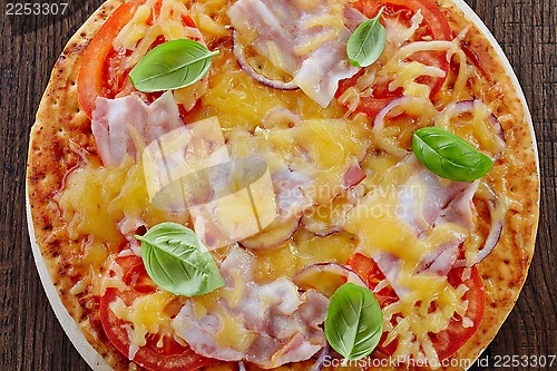 Image of Pizza with bacon and tomato