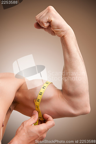 Image of Measuring His Bicep