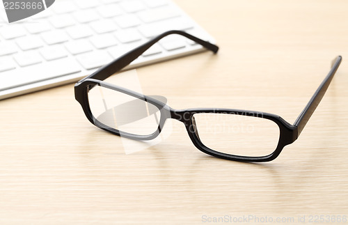 Image of Keyboard and glasses 