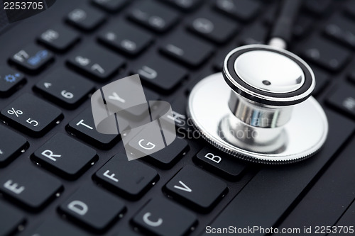 Image of medical stethoscope on computer keyboard