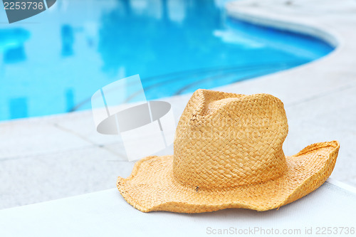 Image of Wicker hat with swimming pool 