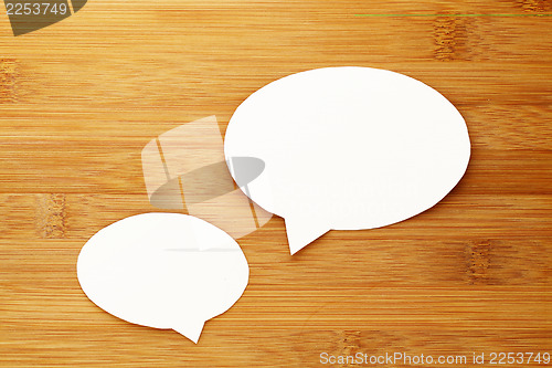 Image of talk speech bubble on wood background