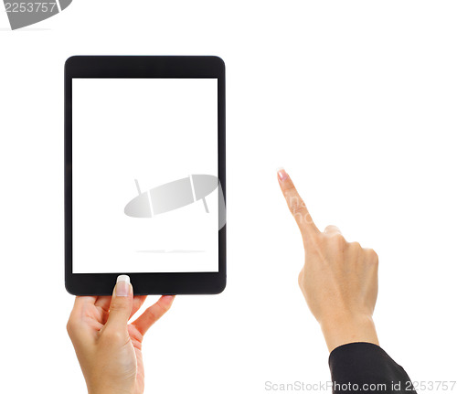 Image of Tablet with human finger 