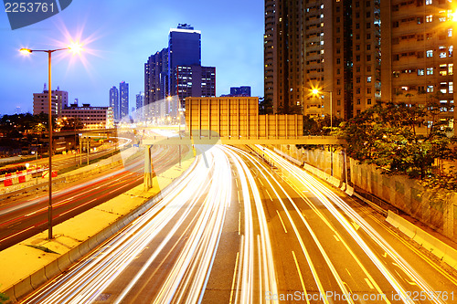 Image of Cityscape at night with light trail 