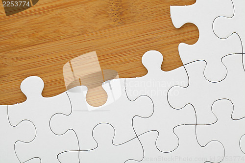 Image of Puzzle on wooden board