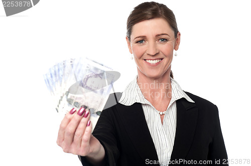 Image of Corprorate woman holding currency notes