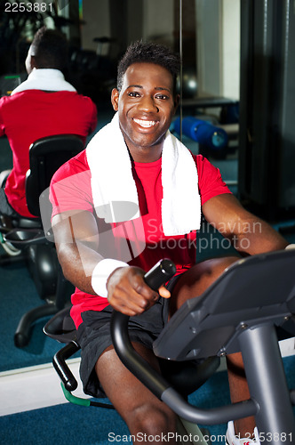 Image of Fit man training in a fitness club
