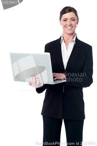 Image of Middle aged professional woman with laptop