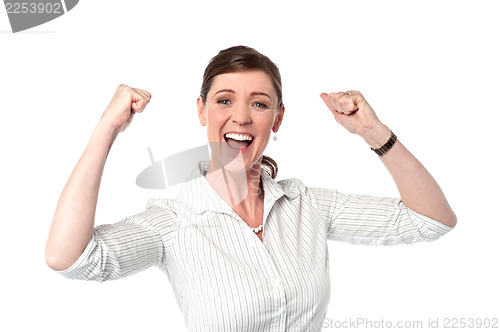 Image of Excited corporate lady with clenched fists