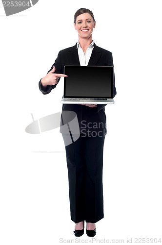 Image of Businesswoman presenting new laptop
