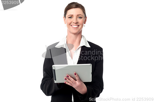 Image of Cheerful business manager holding touch pad