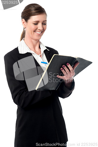 Image of Corporate woman marking her schedule